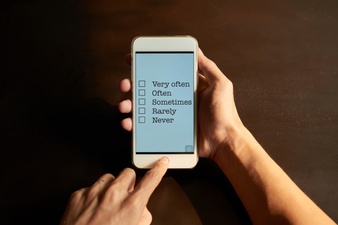 photo of a person viewing a simple online form on a smart phone